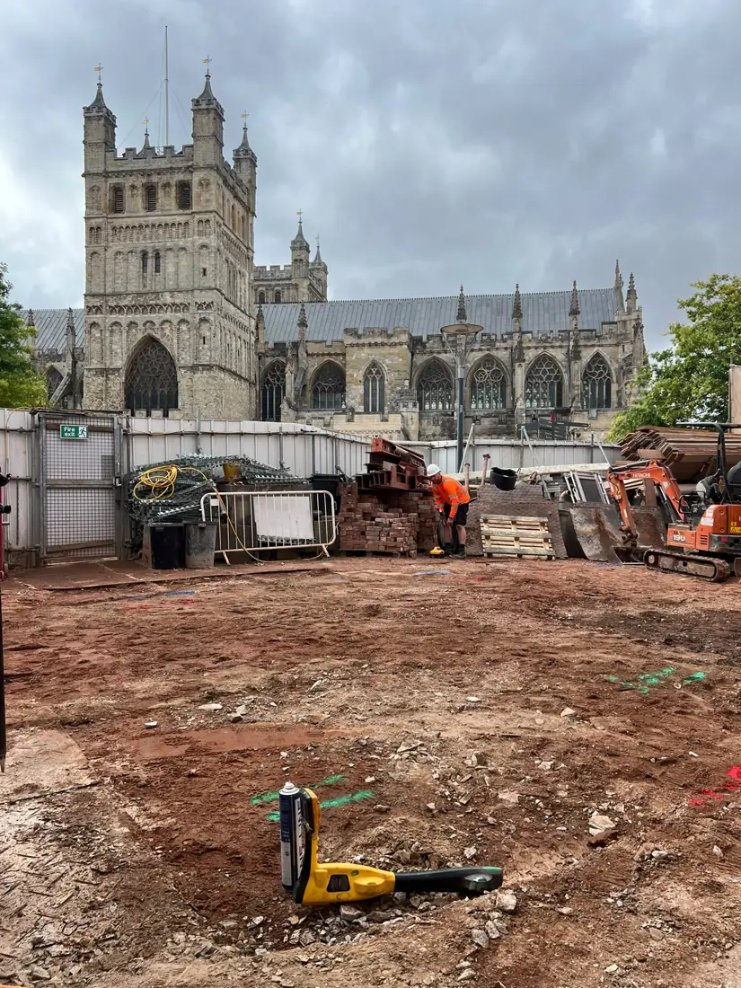 Utility location work on a site beside Exeter Cathedral