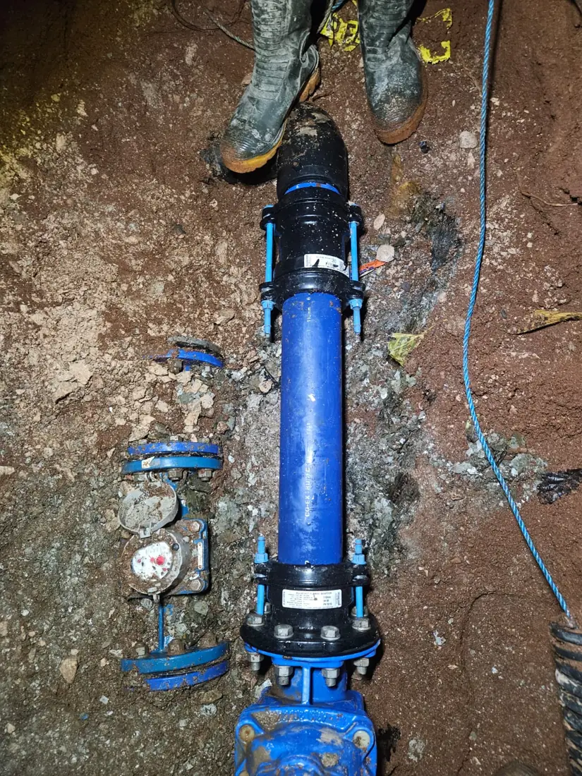 Exposed water main, valve and meter after vacuum excavation